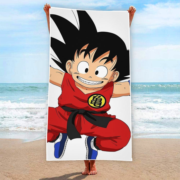 DBZ Jumping Kid Goku In His Training Suit Beach Towel