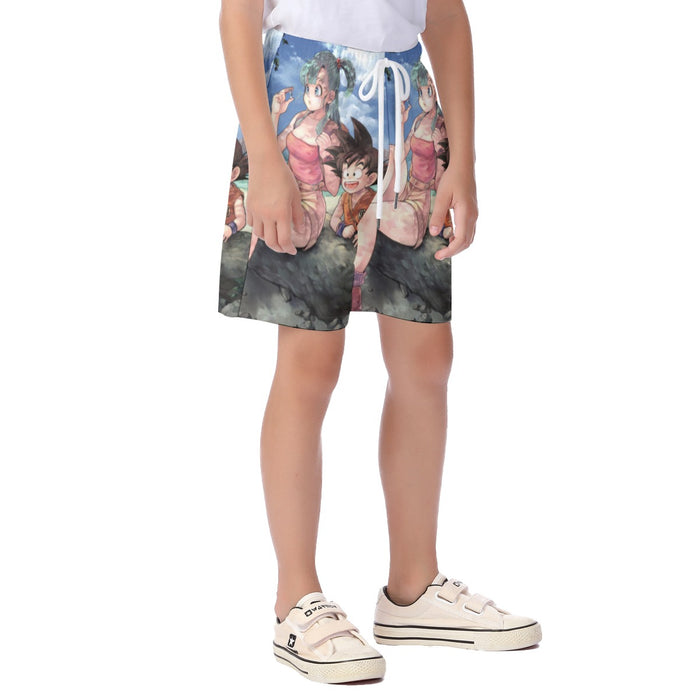 Bulma Sitting on a Tree and Kid Goku at the Beach Blue Graphic DBZ  Kid's Beach Shorts